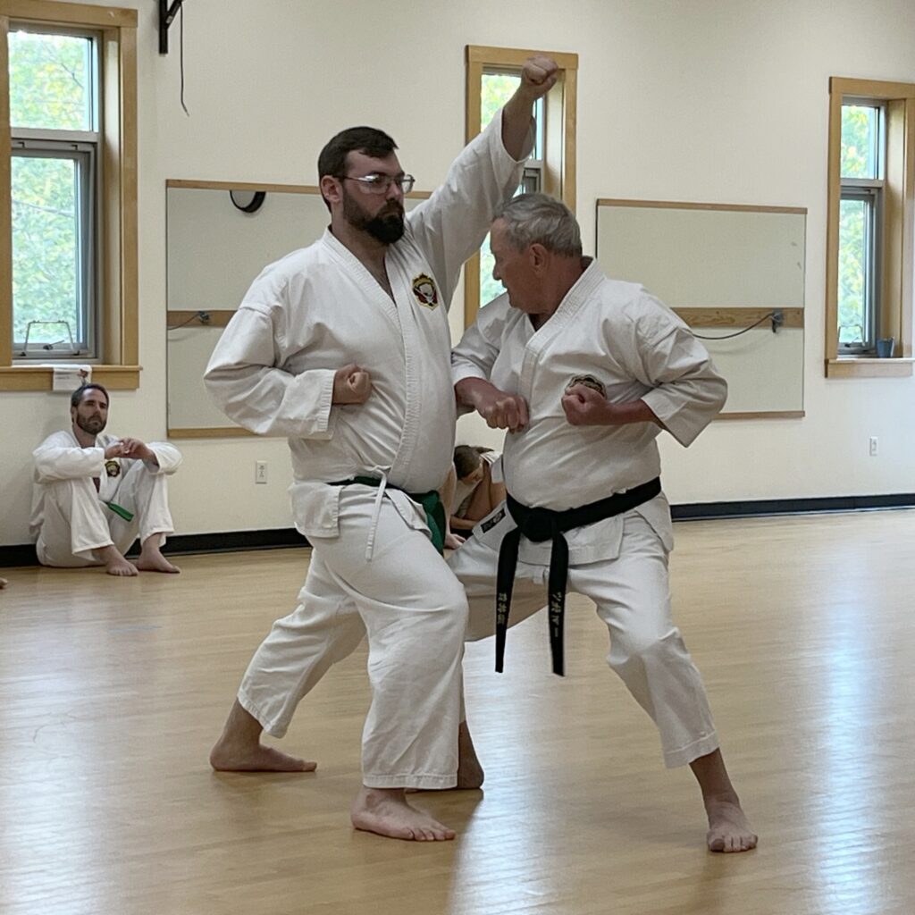 Two karate students engaged in choreographed fighting (Yakusoku kumite)